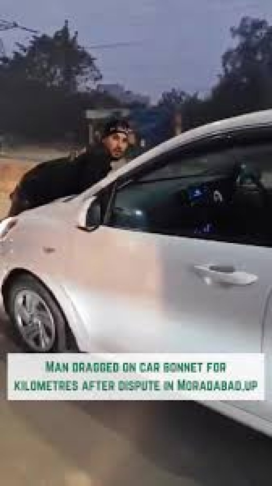 What did the driver do with the young man who climbed on the bonnet of the car?  The video went viral